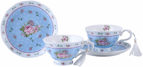 Delicate blue floral porcelain teacups and saucers perfect for displaying on a cake stand