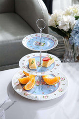 Three-tiered cake stand with floral design, perfect for serving desserts and pastries