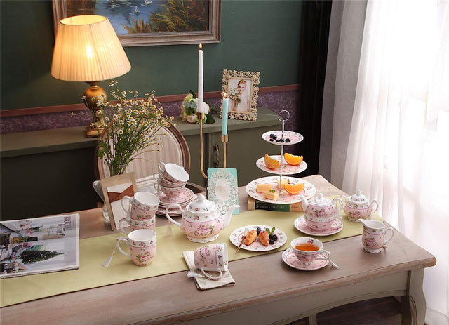 Elegant pink floral Cake Stand on a beautifully set tea table with pastries and fruits