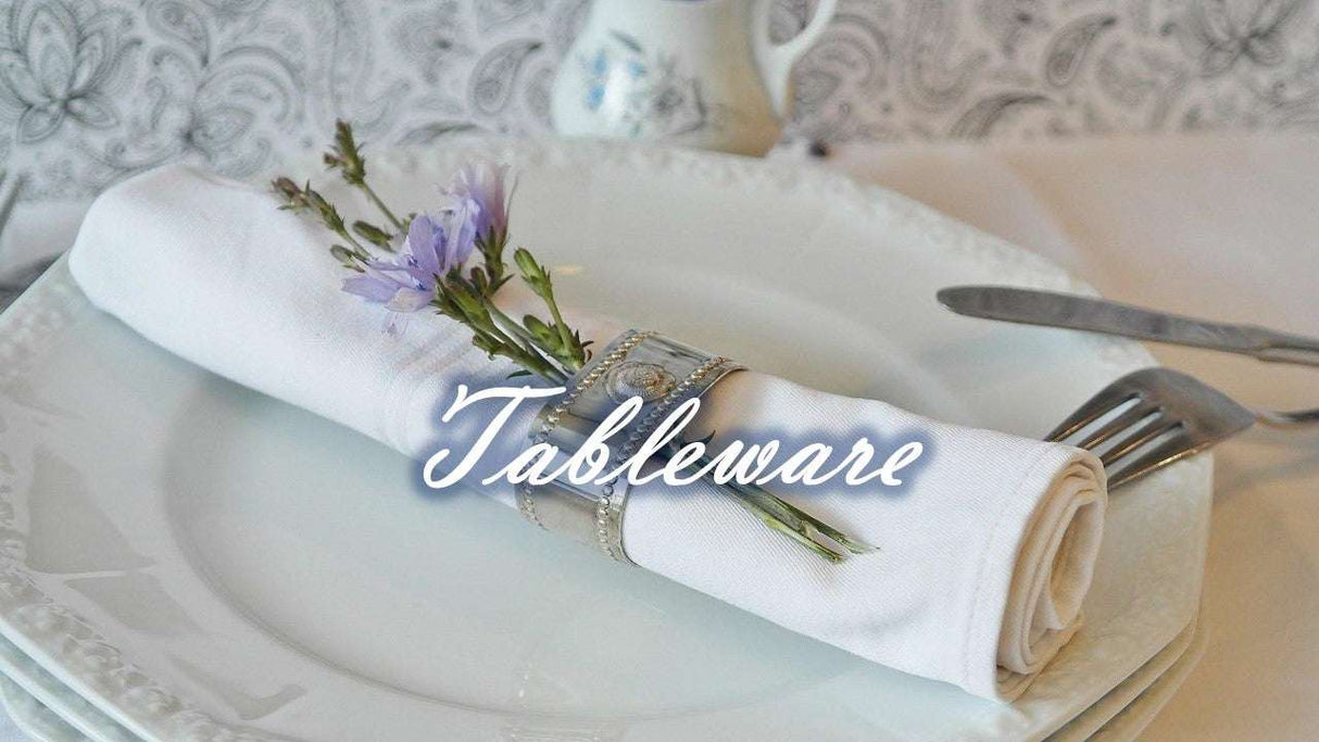 Elegant white Dinner Plates from London Boutique Lifestyle with decorative napkin and floral accent