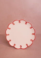 Casa by Josephine Jenno lunch plate with a decorative red scalloped edge for elegant dining