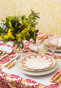 Casa by Josephine Jenno Lunch Plate decorated with red scallop design on a patterned dining table setting