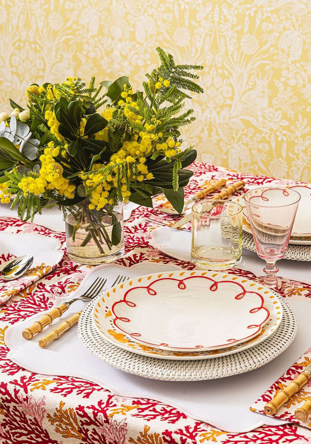 Casa by Josephine Jenno Lunch Plate decorated with red scallop design on a patterned dining table setting