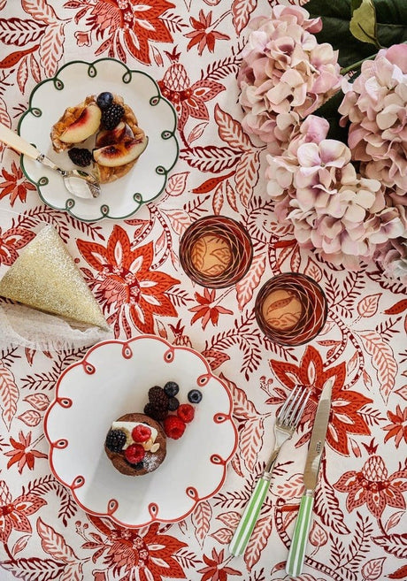 Casa by Josephine Jenno Side Plates on a vibrant floral tablecloth with desserts and fresh berries