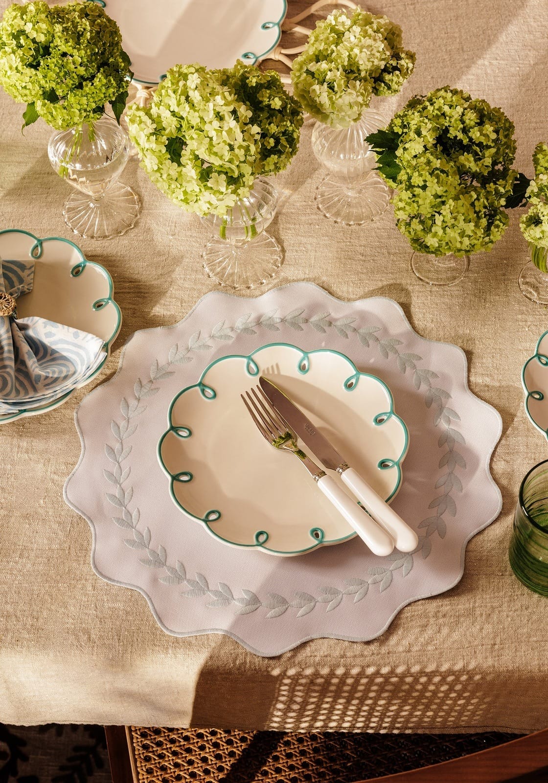 Elegant Casa by Josephine Jenno side plates with decorative edges on a beautifully arranged dining table