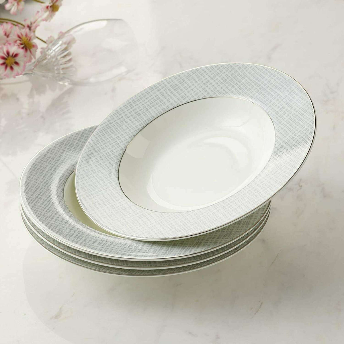 Set of four elegant soup bowls with a fine grey pattern and gold rim detailing