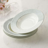 Set of four elegant soup bowls with a fine grey pattern and gold rim detailing