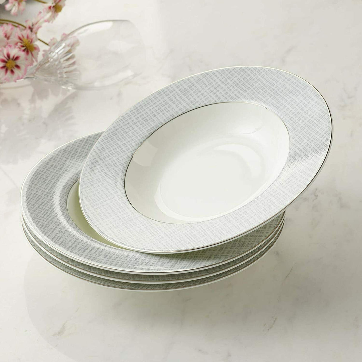 Set of four elegant soup bowls with a fine grey pattern and gold rim detailing