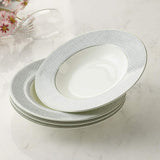 Set of four elegant soup bowls with a fine grey pattern and gold rim detailing