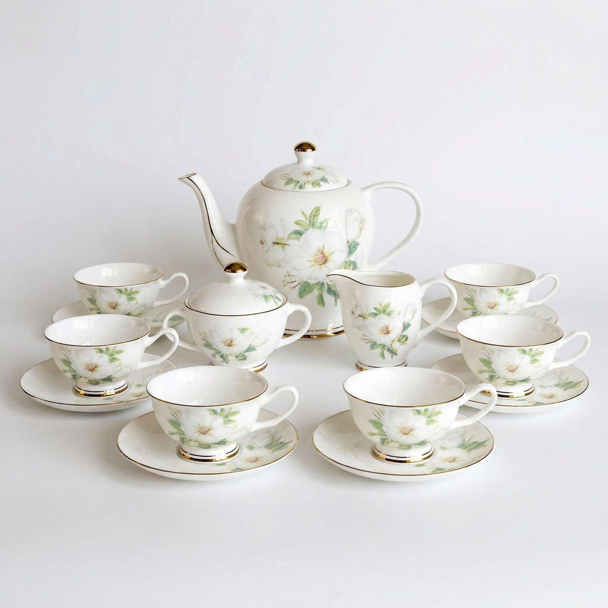 Elegant KitchBoom Tea Set featuring floral design with teapot, cups and saucers for afternoon tea