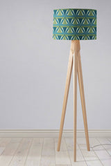 Shadow Bright patterned lampshade on a wooden tripod floor lamp for stylish lighting