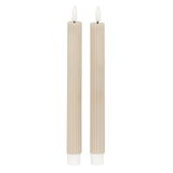 Set of two beige taper candles with ribbed design for elegant table decor