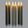 Set of six Shades 4 Seasons taper candles in various earthy colours with warm flickering flames