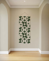 Printworks Tapestry featuring geometric patterns in green and cream for stylish wall decor