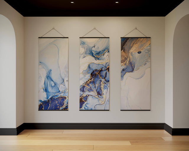 Printworks blue and gold abstract tapestry set hanging on a minimalist wall