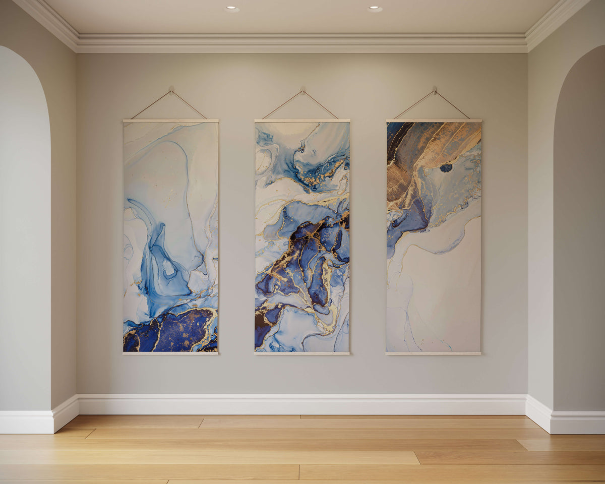 Elegant Printworks tapestry featuring three abstract designs in blue and gold tones, perfect for home decor