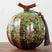 Nisu Home Ceramic Tea Jar in Green with Decorative Tassel and Unique Design