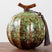 Nisu Home Ceramic Tea Jar in Green with Decorative Tassel and Unique Design