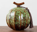 Nisu Home Ceramic Tea Jar in Green with Decorative Tassel and Unique Design