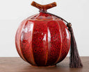 Nisu Home Decorative Red Tea Jar with Unique Shape and Tassel Detail for Elegant Storage