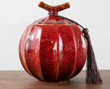 Nisu Home Decorative Red Tea Jar with Unique Shape and Tassel Detail for Elegant Storage