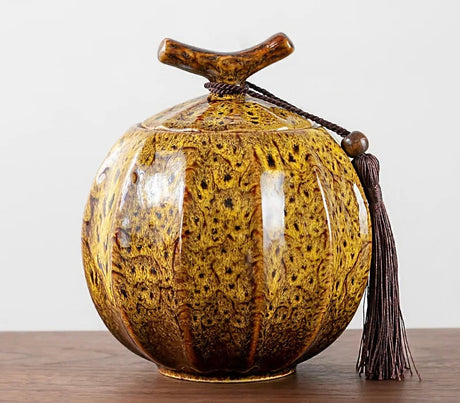 Nisu Home Ceramic Tea Jar with a Unique Design and Decorative Tassel for Stylish Tea Storage