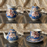 KitchBoom elegant tea set with floral designs, including a teapot, sugar bowl, and cup on a matching saucer