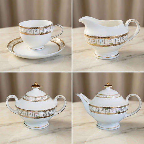 Elegant KitchBoom Tea Set with Gold Greek Key Design, including cups, creamer, and teapot