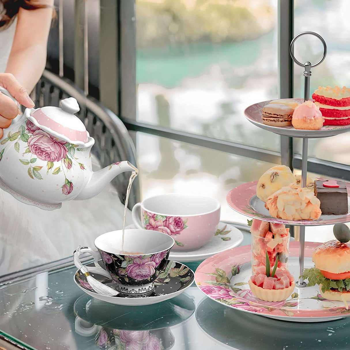 Elegant tea set featuring floral designs with a teapot and fine china cups for afternoon tea