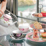 Elegant tea set featuring floral designs with a teapot and fine china cups for afternoon tea