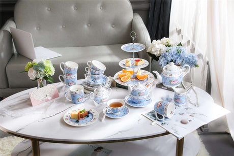 Elegant tea set display featuring a Sugar Bowl and assorted pastries on a stylish coffee table
