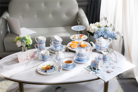 Elegant tea set display featuring a Sugar Bowl and assorted pastries on a stylish coffee table