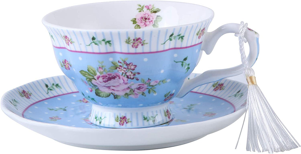 Delicate blue floral tea cups and saucer set featuring pink roses, perfect for elegant tea occasions