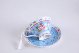 Elegant blue tea cups with floral design and tassel detail for a charming tea party experience