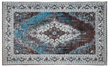 Orsina Teal Rug with intricate patterns and a blend of teal and brown for a stylish home decor