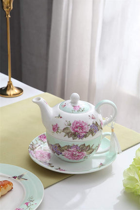 Elegant floral teapot with a matching saucer from London Boutique Lifestyle for tea lovers