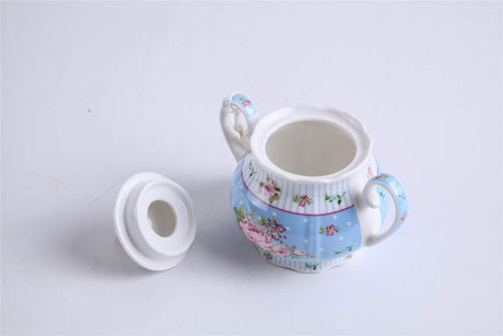 Delicate porcelain Teapot Set in blue with floral designs, perfect for elegant tea parties