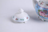 Elegant porcelain Teapot Set featuring floral patterns and fine blue stripes for stylish tea servings