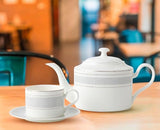 Elegant white teapot set with matching cup and saucer for stylish tea breaks