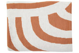 Orsina Terracotta Throw with modern wave pattern in warm terracotta and cream colours