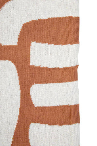 Orsina Terracotta Throw featuring a bold abstract design in terracotta and cream colours