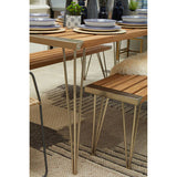 Orsina Textured Rug in a modern dining setting with wooden table and stylish tableware