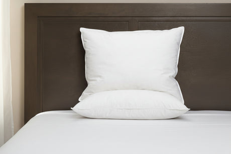White Pillow from PillowPillow on a bed with a wooden headboard for comfort and support