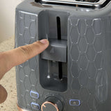 Close-up of Wise Galleria Toaster Set control panel with a finger adjusting settings