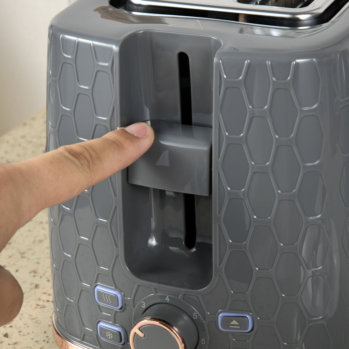 Close-up of Wise Galleria Toaster Set control panel with a finger adjusting settings