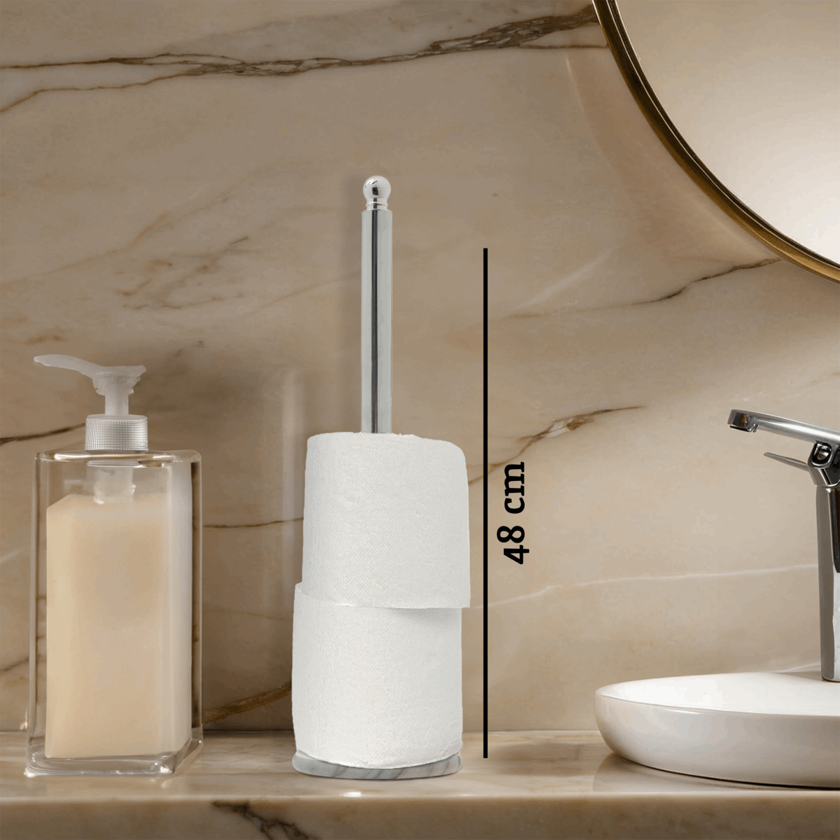 Orsina Toilet Roll Holder in silver finish displayed next to soap dispenser on marble countertop