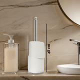 Orsina Toilet Roll Holder in silver finish displayed next to soap dispenser on marble countertop