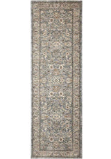 Elegant traditional rug with intricate floral patterns in soft blue and beige tones