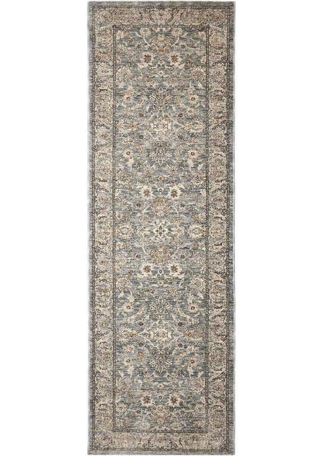 Elegant traditional rug with intricate floral patterns in soft blue and beige tones