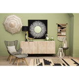 Stylish living room featuring the Trenza Rug on the floor with decorative wall art and furniture